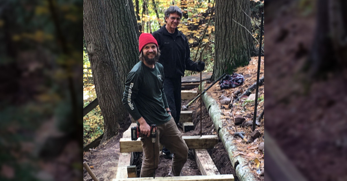 Will Krift and Gene Lemmenes standing in the foundation framing for the new boardwalk.